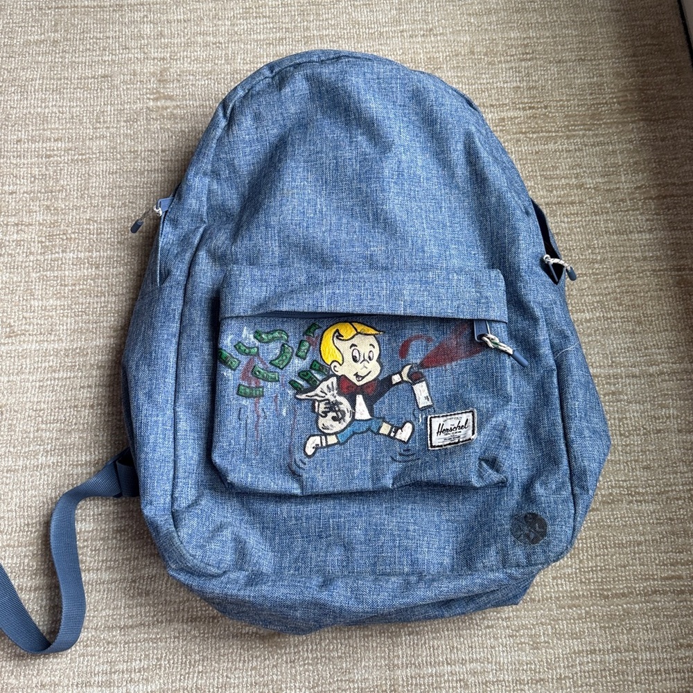 Herschel custom cartoon painted denim blue backpack. Slightly used.